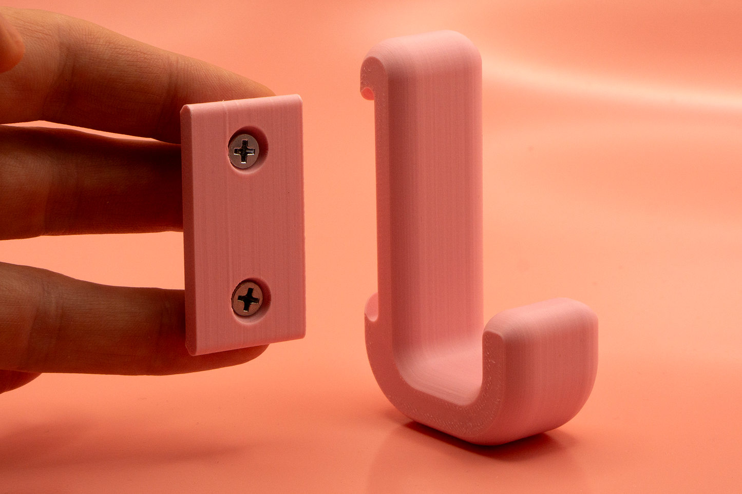 Haken mit versteckten Befestigung